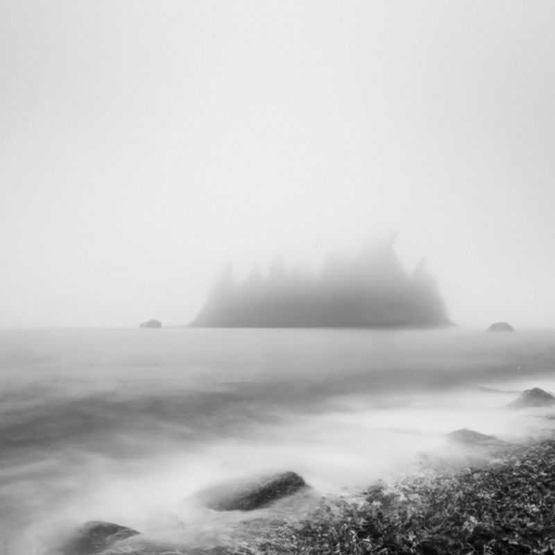 Solitary figure of a digital nomad, enveloped in the serene embrace of winter, embarking on a 3-week solo journey along the breathtaking Juan de Fuca Trail in Canada, a haven for nature enthusiasts seeking tranquility and digital liberation.