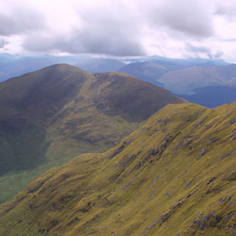 A family with children embarks on a memorable 2&#45;week adventure during the enchanting transition from summer to fall, amidst the breathtaking landscapes of Aonach Eagach Ridge, Scotland, capturing moments of joy and discovery in the heart of nature's grandeur.